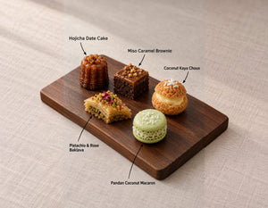 Sweets canapes on a wooden board, labelled Hojicha Date Cake and 4 more. Cuseho canape catering, Singapore