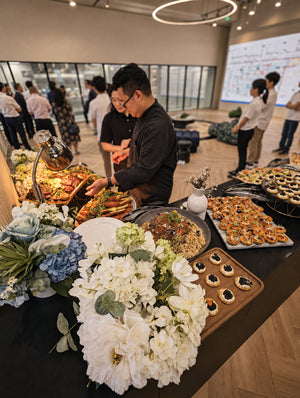 Chef serving at a live station during a corporate event. Cuseho desserts live station catering, Singapore