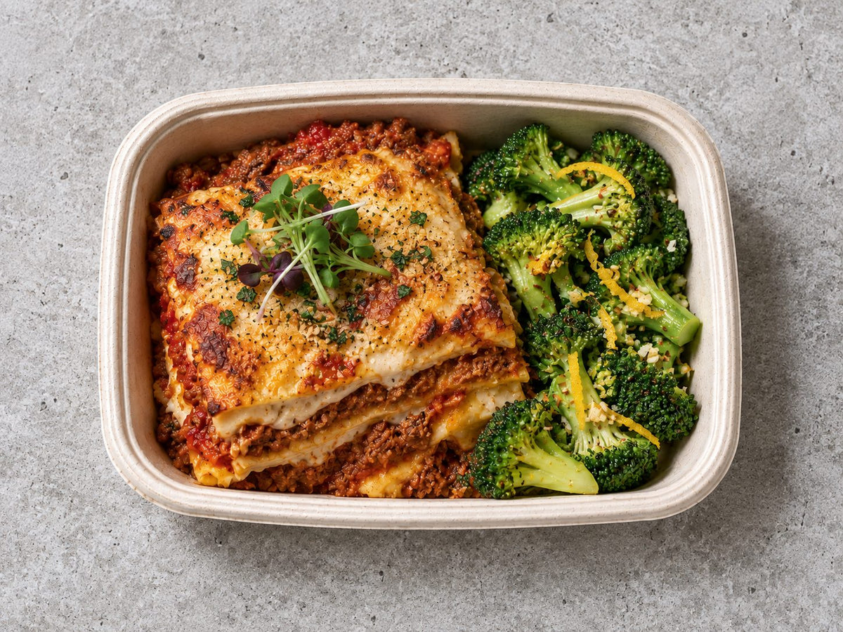 Plant Based "Meat Zero" Lasagna Gratin with pomodoro sauce, vegan bechamel, citrus garlic broccoli. Cuseho bento catering, Singapore