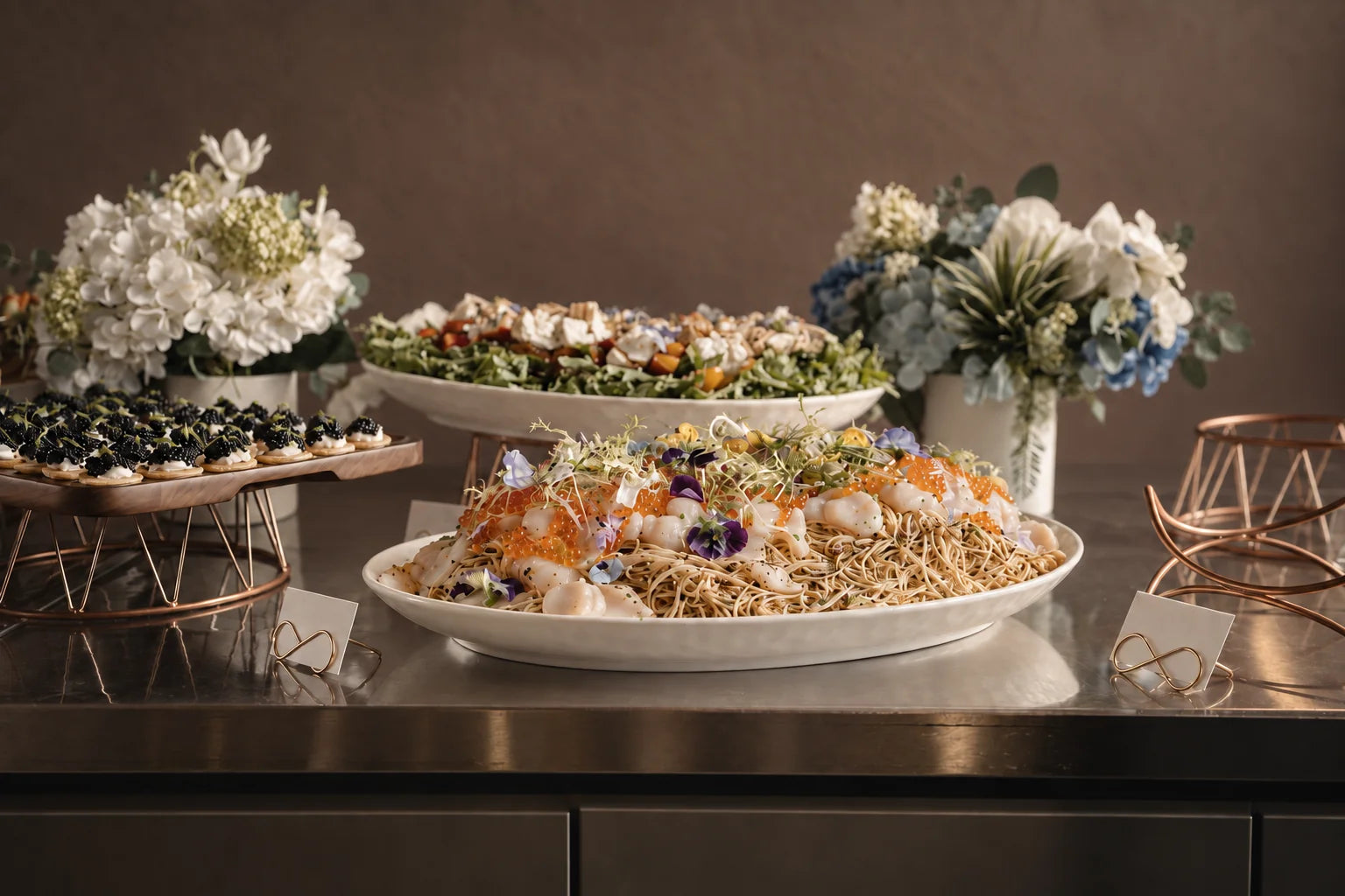 Seafood and noodles presented on a buffet counter